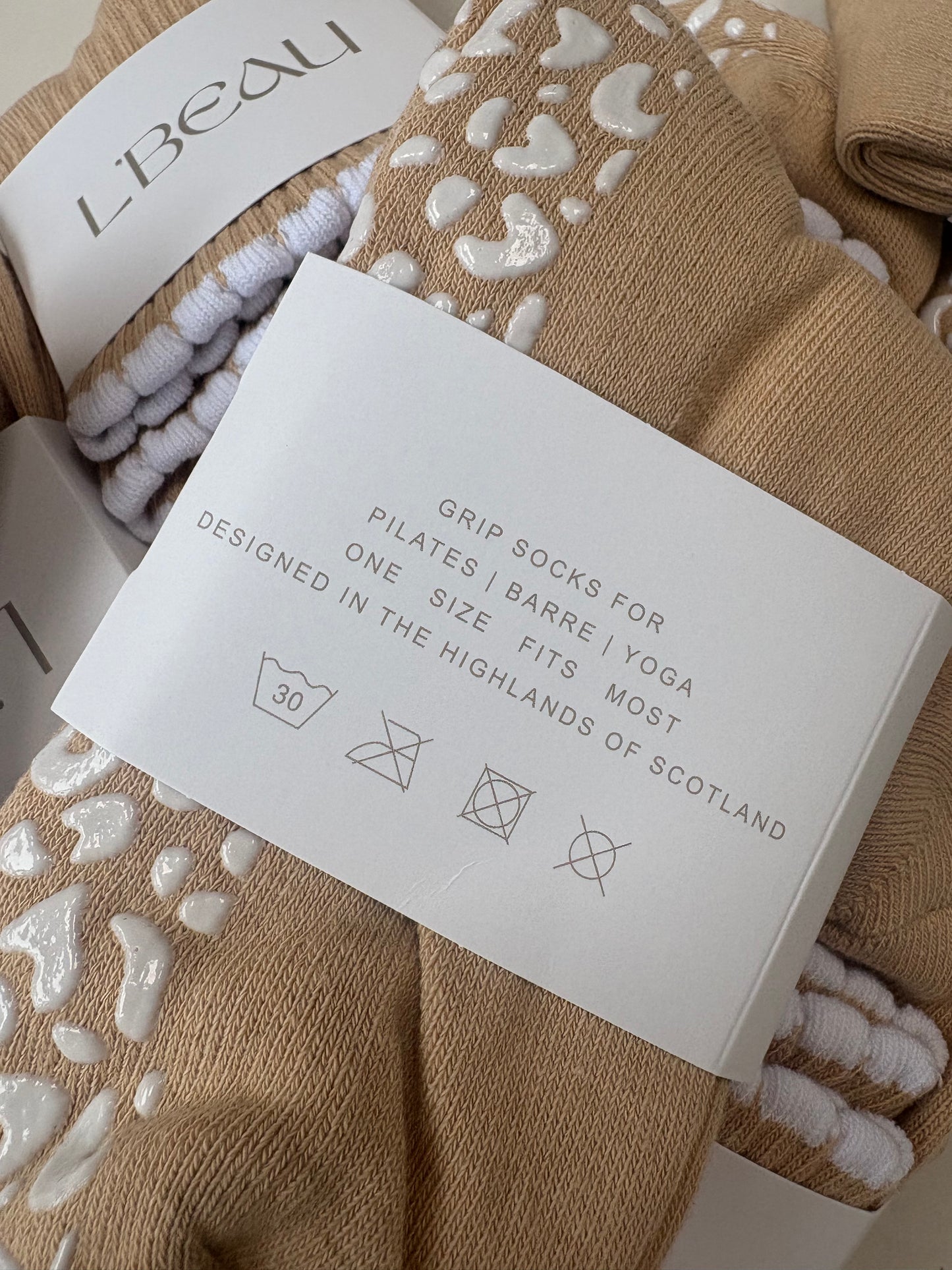 Tan and white bubble hem grip socks