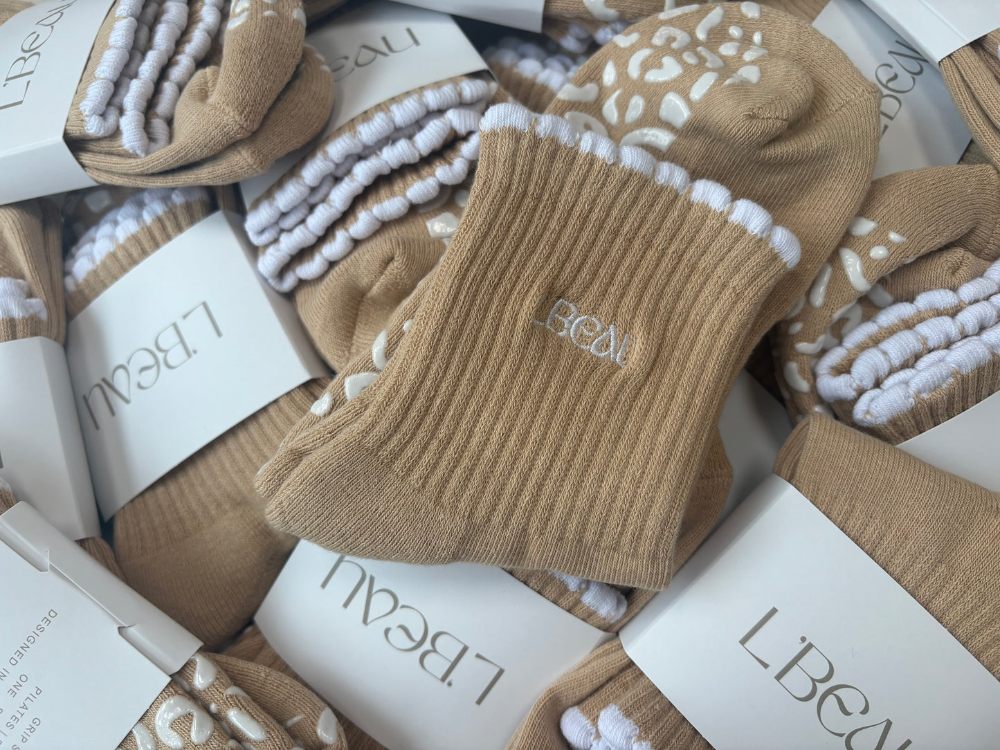 Tan and white bubble hem grip socks