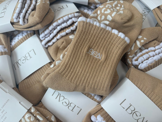 Tan and white bubble hem grip socks