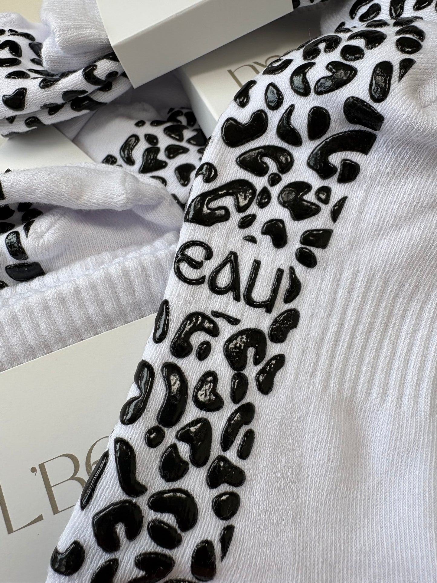 White and black animal print grip socks
