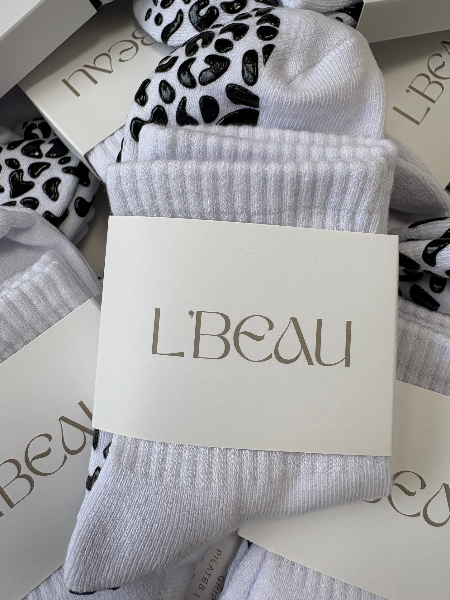 White and black animal print grip socks