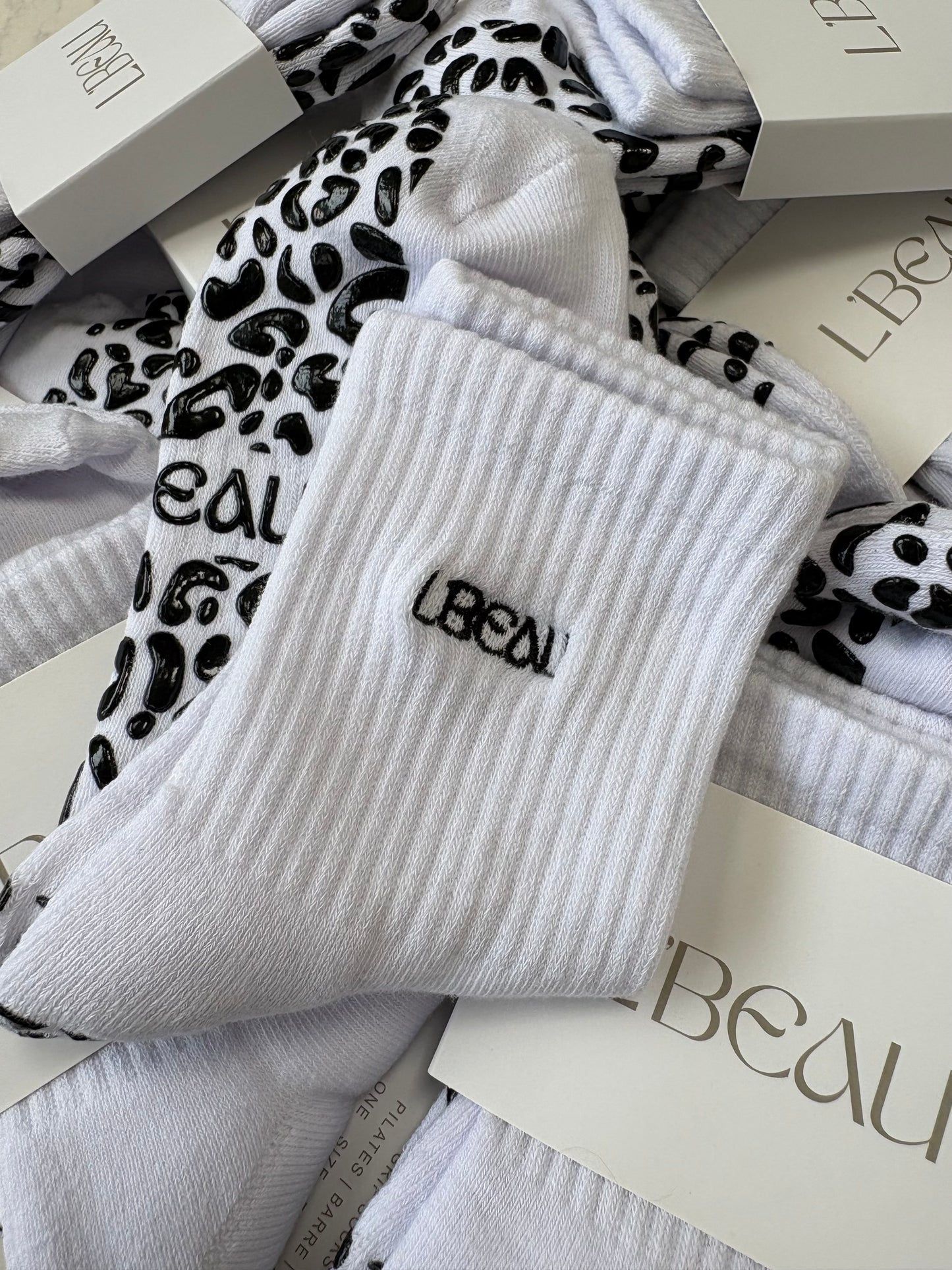 White and black animal print grip socks