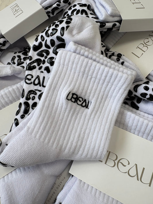 White and black animal print grip socks
