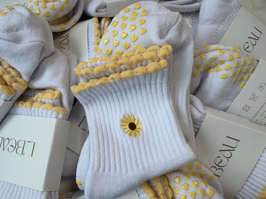 Highland Hospice Yellow and White Heart grip socks